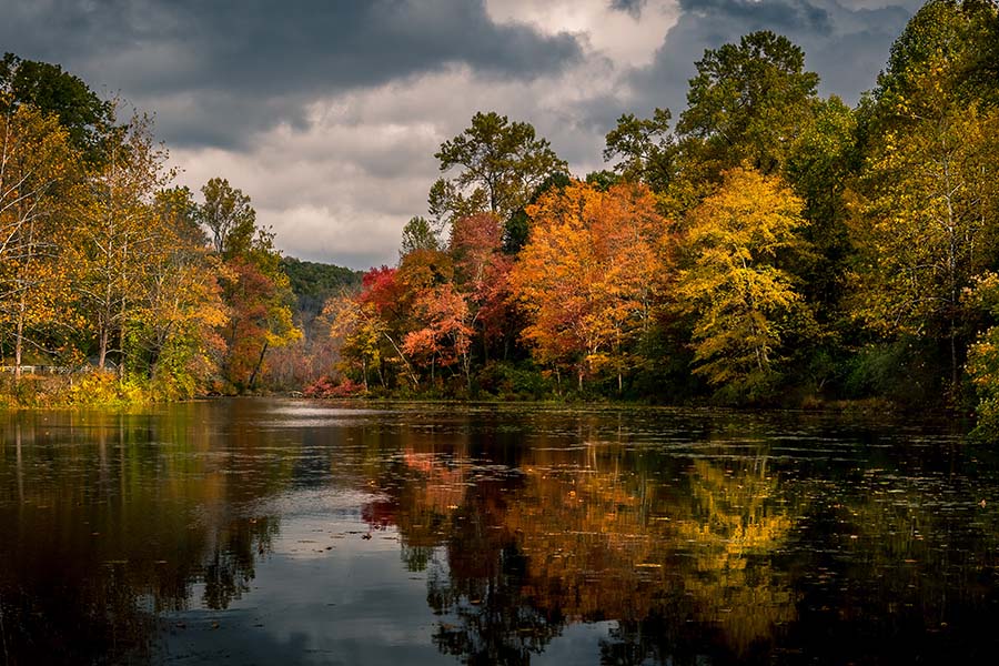 New Jersey - Closeup View of Calm Lake Surrounded by Fall Foliage Reflected in the Water in New Jersey